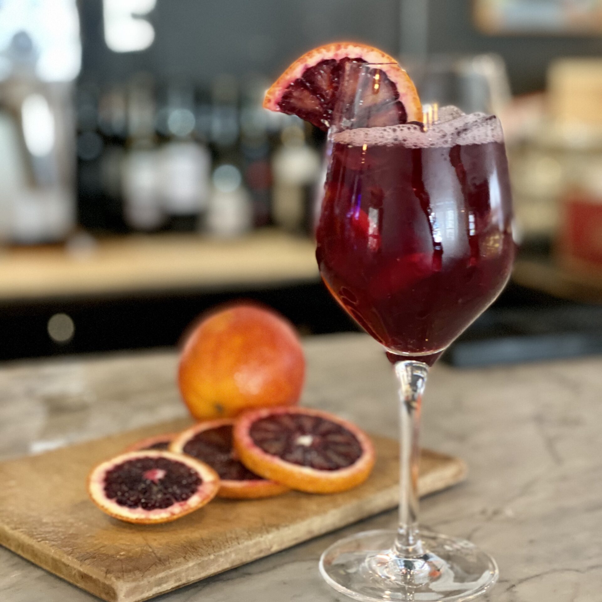 Pitcher and glass of fresh fruit sangria